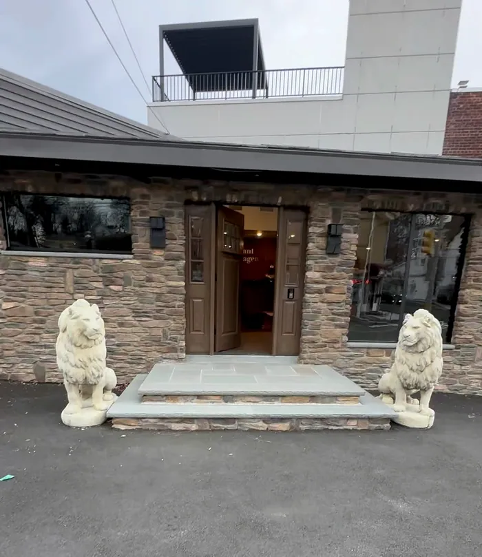 Stained and sealed wood doors and trim at a stone entry