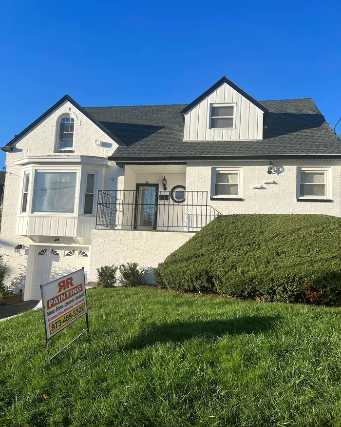 Exterior repaint: Siding and trim, sign still on the lawn.